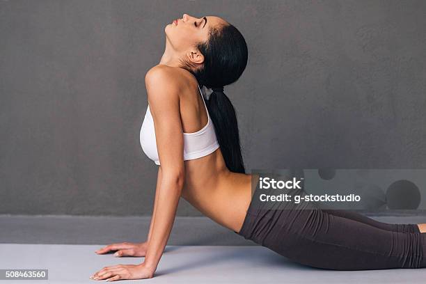 Upward Facing Dog Stock Photo - Download Image Now - 20-29 Years, Adult, Adults Only