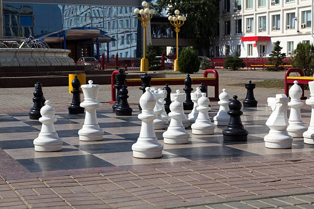 Outdoor chess board with big figures Outdoor chess board with big figures republic of kalmykia stock pictures, royalty-free photos & images