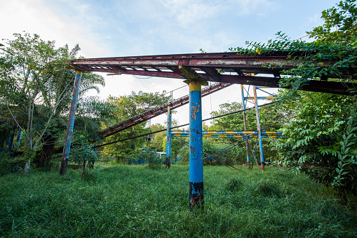 Rusty decayed roller coaster tracks at Yangon abandoned amusement park, Myanmar
