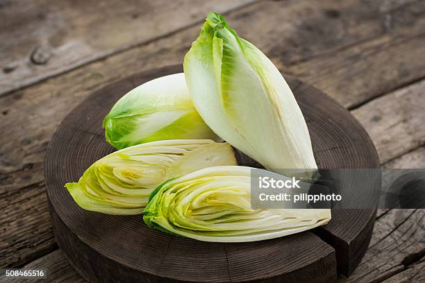 Fresh Witloof On The Wooden Table Stock Photo - Download Image Now - Endive, Chicory, Vegetable