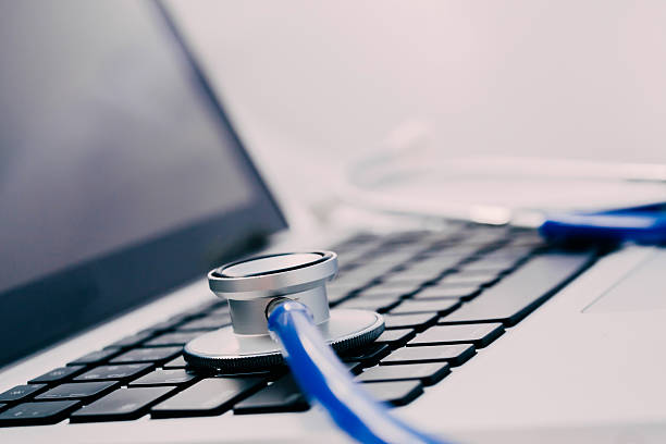 Stethoscope on laptop - Computer repair and maintenance concept