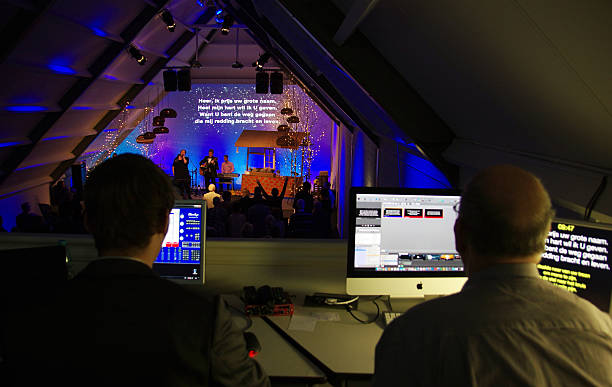 Technicians controlling the concert Schinnen, the Netherlands- December 25, 2015: Technicians controlling the concert on Christmas eve. The sound is sweet and tender. singer back stock pictures, royalty-free photos & images