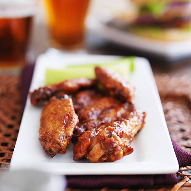 istock plate of bbq chicken wings on platter 508465783