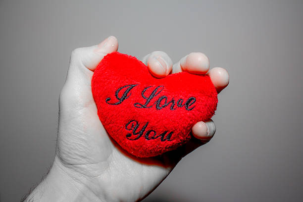 istock hand holding a heart that says 