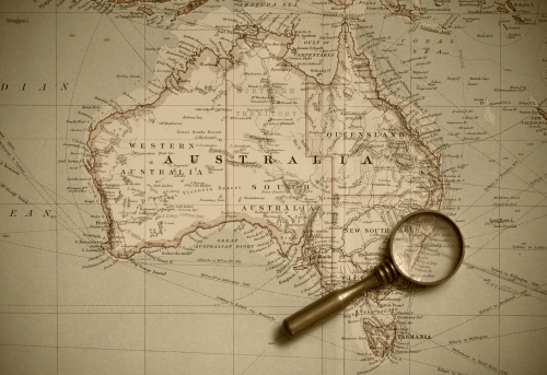 A map of Australia from 1920, complete with magnifying glass. Sepia tinted.