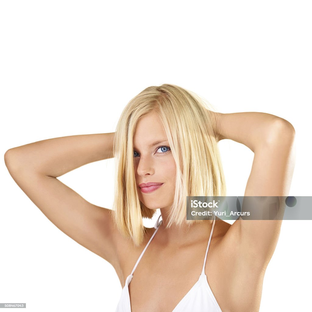 Blonde and beautiful A beautiful young blonde woman isolated against a background smiling at the camera 20-24 Years Stock Photo