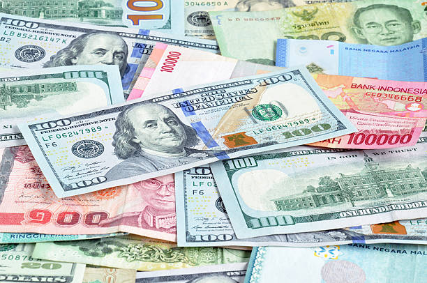 istock Money in multi currencies with 100 USD bill on top 508467065