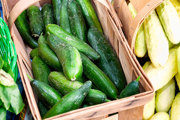 istock Fresh Green Organic Cucumbers in a Basket 508467257