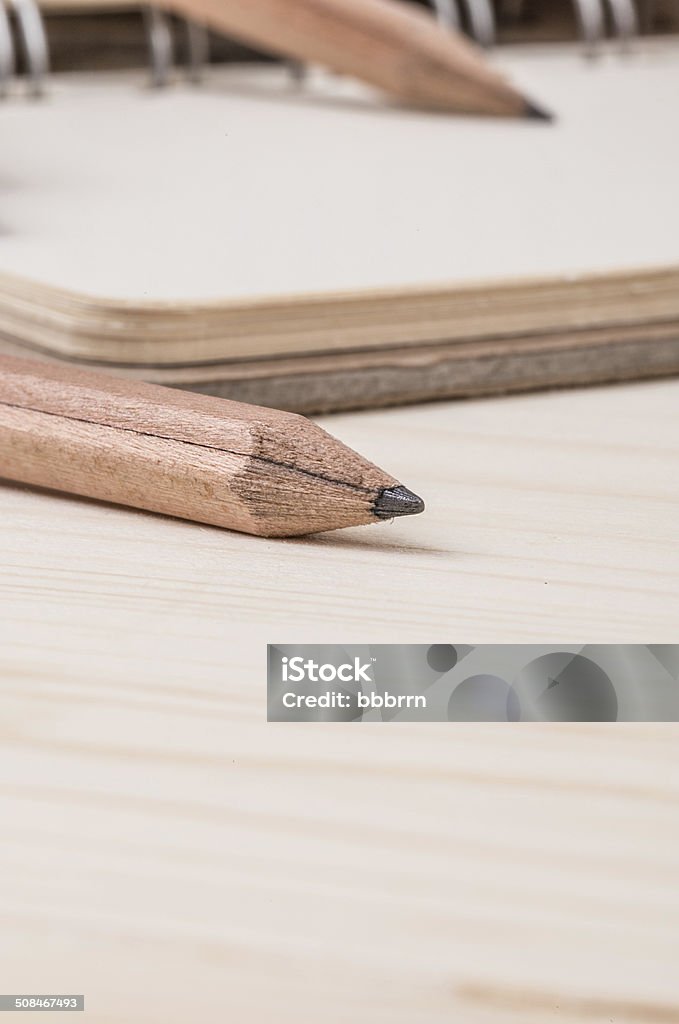 pencil and notebook close up pencil and notebook on table Black Color Stock Photo