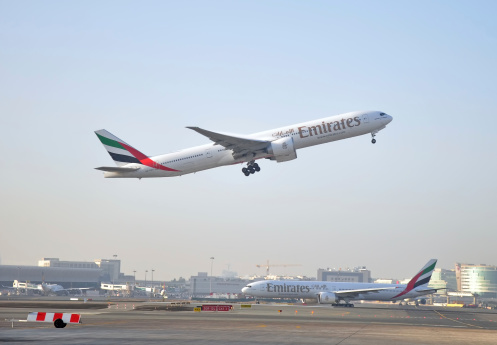 Dubai, United Arab Emirates - January 12, 2014: Emirates Boeing 777-200 take off at Dubai International Airport Terminal 3 on January 12, 2014. Emirates is an airline based in Dubai.