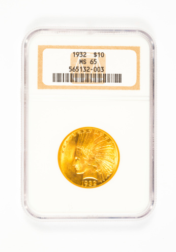 Springfield, OR, USA - April 2, 2014: Rare 1932 Indian Head gold 10 dollar coin graded MS65 by NGC.