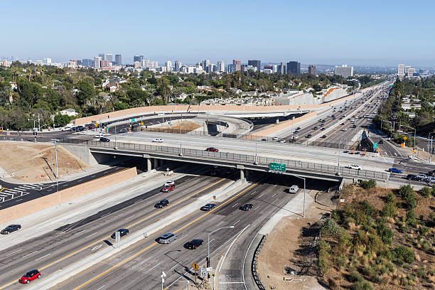 San Diego Freeway Day Los Angeles, California, USA - August 17, 2014: Sunday afternoon traffic on Los Angeles's busy San Diego 405 Freeway at Sunset Blvd.   highway 405 photos stock pictures, royalty-free photos & images