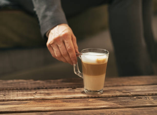 istock Closeup on business woman taking coffee latte from table 508471549