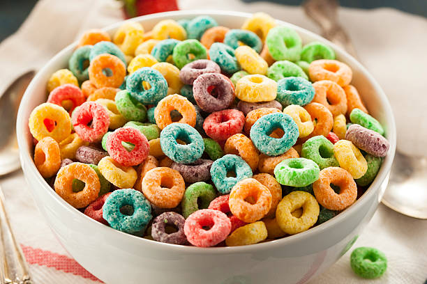 Coloful Fruit Cereal Loops Coloful Fruit Cereal Loops in a Bowl grain bowl stock pictures, royalty-free photos & images