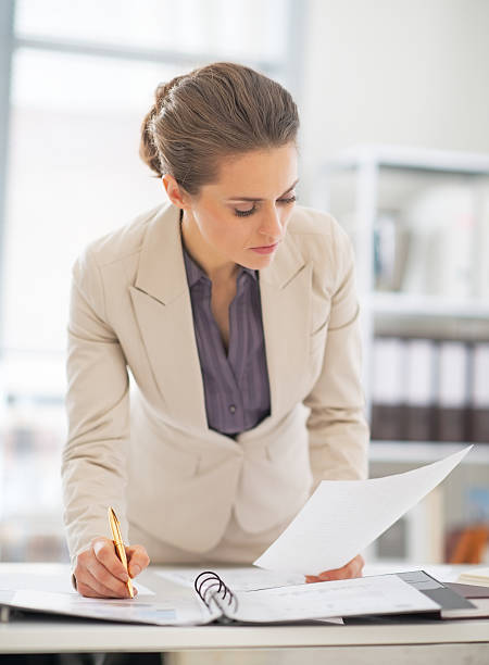 istock business woman working with documents in office 508473469