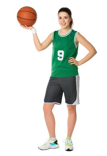 Young girl basketball player isolated