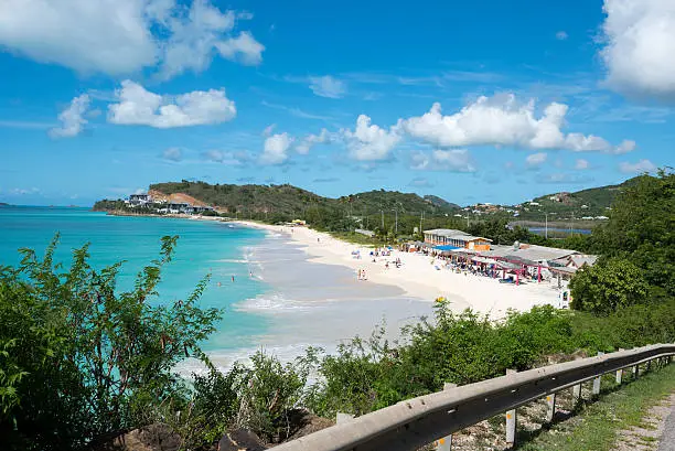 Sandy beach and blue waters of the Caribbean Sea at Darkwood Beach on the island of Antigua