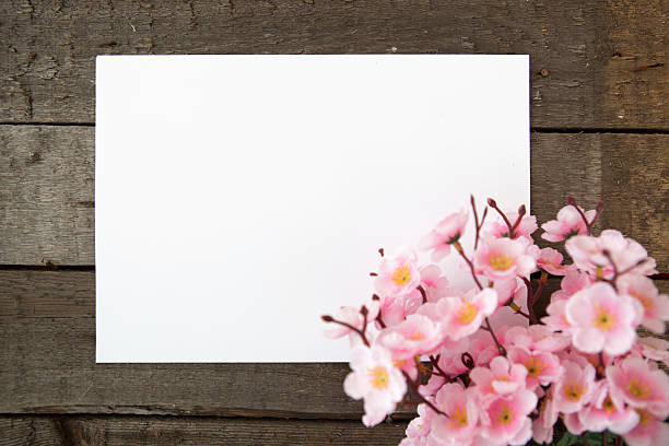 istock Sakura, paper and wooden background 508485020