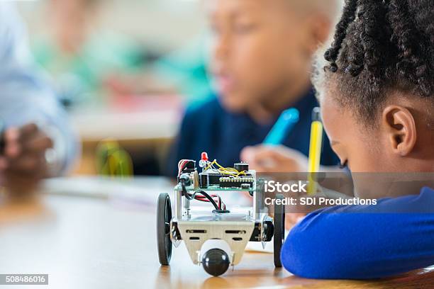 Robots For A Science Lesson Elementary Student Using Robotics Kit In Science Class Stock Photo ...