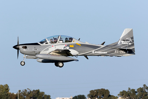 Beja, Portugal: parked General Dynamics F-16 Fighting Falcons of the Portuguese Air Force - in the foreground a twin-seat F-16 BM version, the rest are F16 AMs - equipped with external fuel tanks - Beja Airport serves both civil and military aviation.