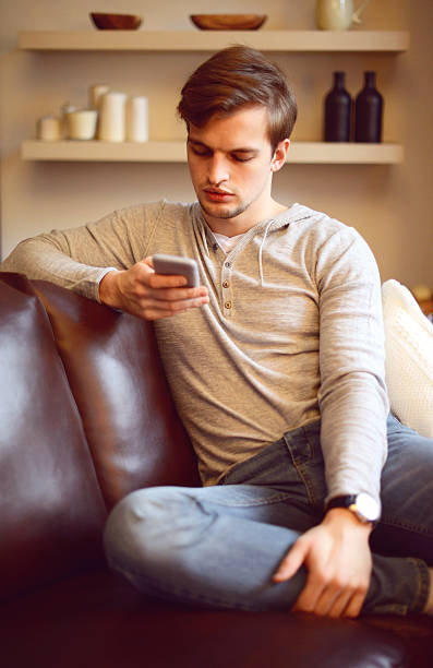 istock attractive young man in home interior 508487890