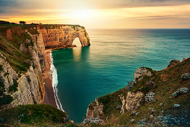 sunset in Etretat nature landscape in the sunset in Etretat, France in beautiful summer day. normandy photos stock pictures, royalty-free photos & images