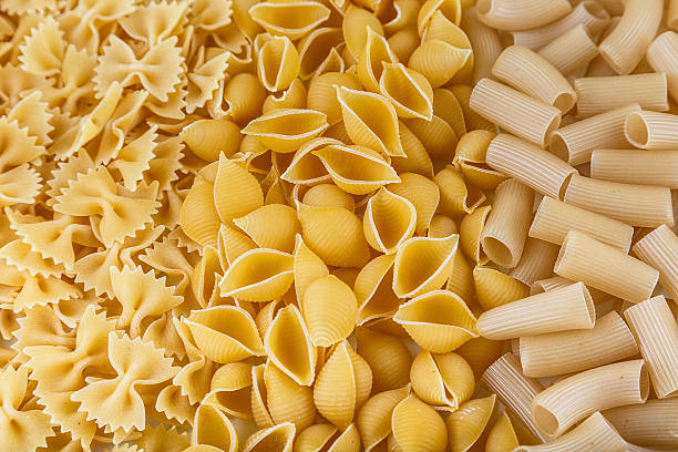 istock Mound of pasta on a white background close-up macro 508491998