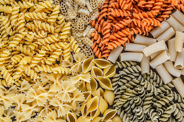 istock Mound of pasta on a white background close-up macro 508492254