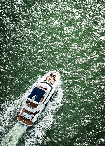 Large group of people sailing and having fun on a yacht.