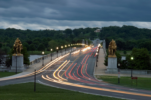 Arlington Memorial Bridge at dusk. Rush hour traffic crosses the bridge leaving Washington.