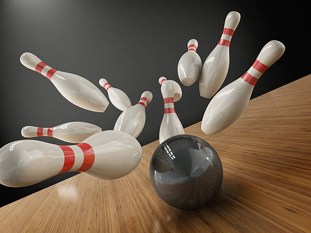 istock scattered skittle and bowling ball on white background 508496622