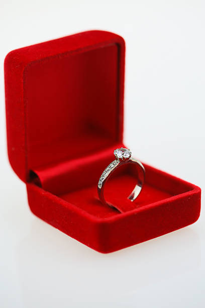istock Wedding rings background, beautiful silver ring in red box 508497080
