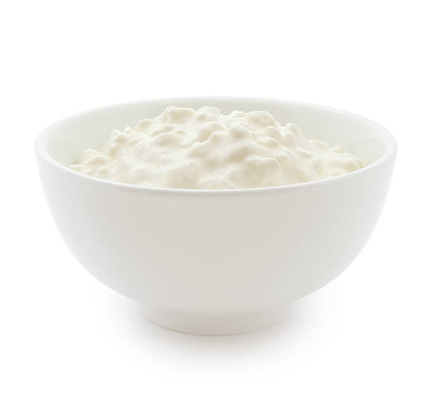 Cottage Cheese Cottage Cheese bowl isolated on white (excluding the shadow) cottage cheese photos stock pictures, royalty-free photos & images