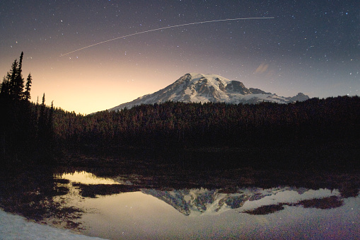 The International Space Station passe over Mt. Rainier, WA just after sunset. Reflection Lake in Mt. Rainier NP mirrors the event.