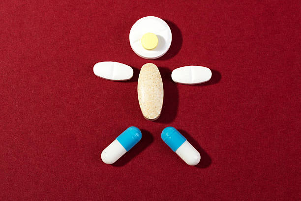 istock medicine capsule on a red background 508498358