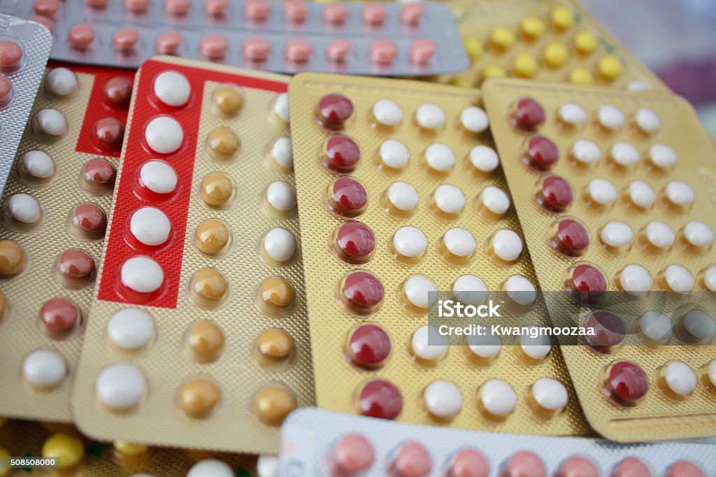 Colorful oral contraceptive pill Acne Stock Photo