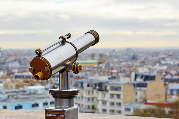 istock Touristic telescope overlooking Montmartre 508508086