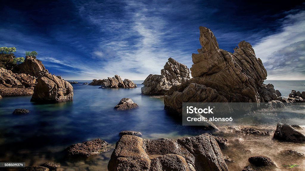 The blue Lagoon Cala Frares is a little bay at the Costa Brava (rough coast). Beach Stock Photo