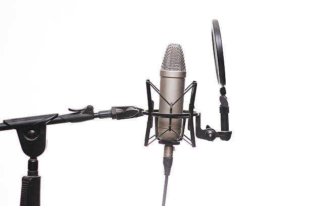 Audio recording studio mic on a stand with a filter stock photo