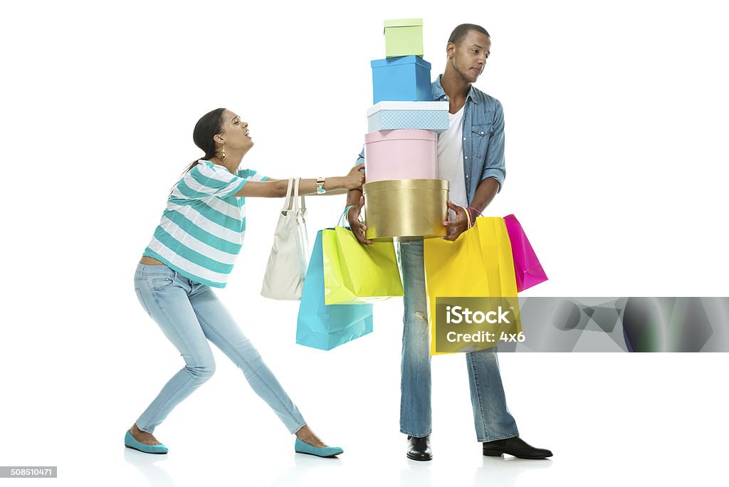 Girlfriend pulling her boyfriend Girlfriend pulling her boyfriendhttp://www.twodozendesign.info/i/1.png Bag Stock Photo