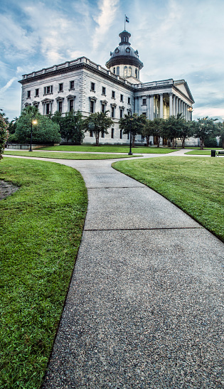 Drastic vertical format view of a walkway leading to the South Carolina state capitol building in Columbia.