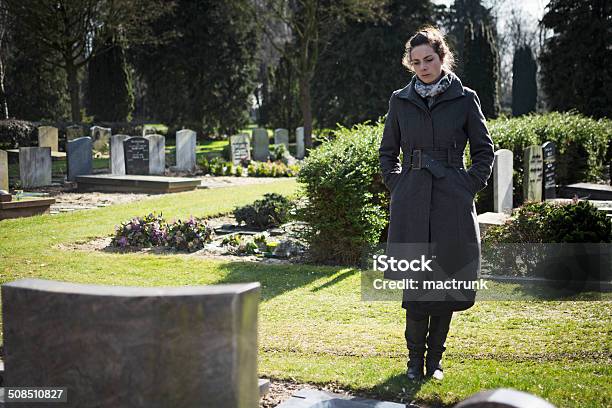 Woman Standing At Grave Stock Photo - Download Image Now - Funeral, Child, Widow