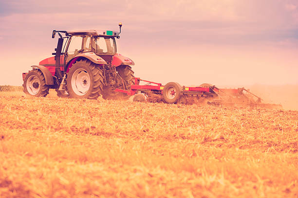 istock Tractor cultivating wheat stubble field, crop residue. 508511063