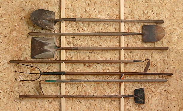 Tool Shed New tool shed with horizontally placed vintage tools trowel gardening shovel gardening equipment stock pictures, royalty-free photos & images