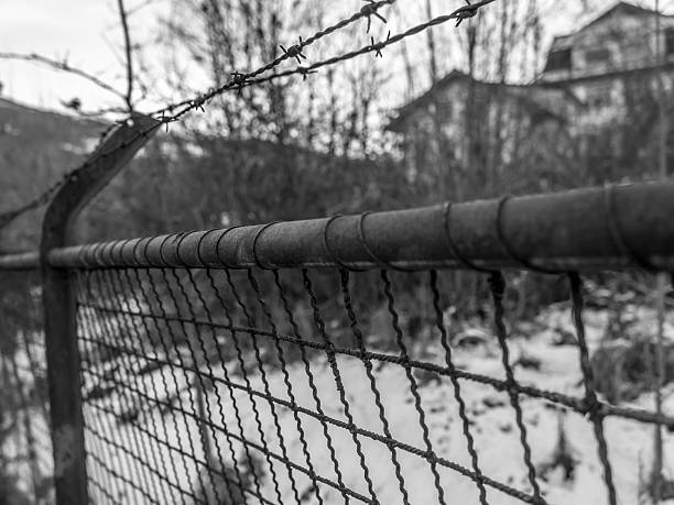 istock Old and Rusty Black and White Fence 508512644