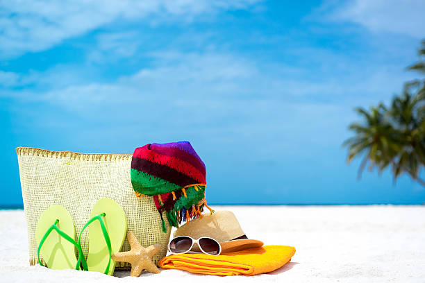 istock Summer beach bag with starfish, towel, sunglasses and flip flops 508512805