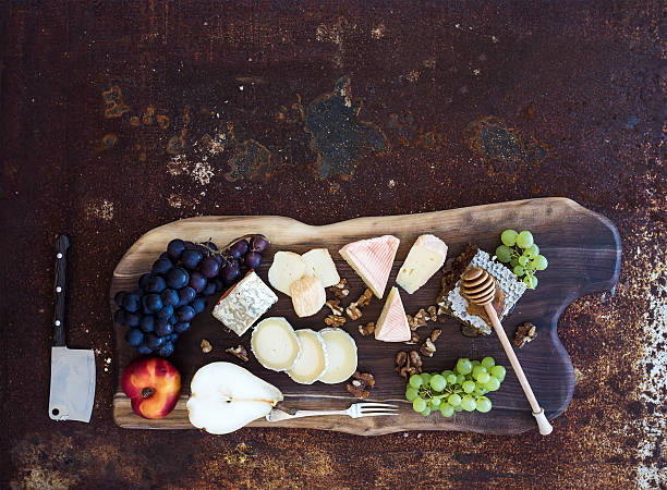 istock Wine appetizers set: French cheese selection, honeycomb, grapes, peach and 508513250