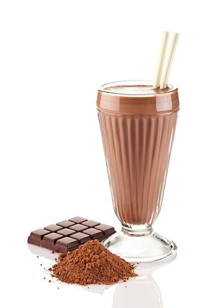 istock Chocolate milk shake glass with chocolate bar and ground cocoa 508514157