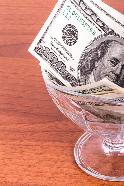istock Dollar Banknotes in Glass Bowl 508514773
