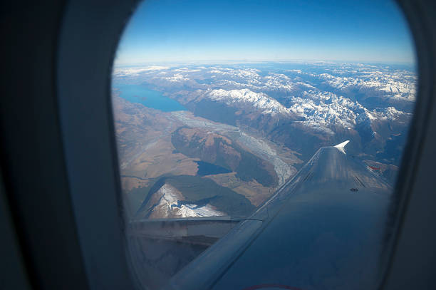New Zealand Alps from an airplane New Zealand Alps from an airplane window stratosphere airplane cloudscape mountain stock pictures, royalty-free photos & images